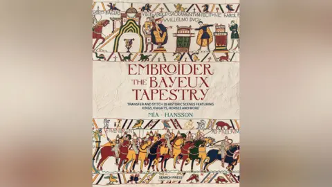 Search Press The front cover of a book called Embroider the Bayeux Tapestry. There are images of the tapestry on it, showing horses and men holding weapons and shields.