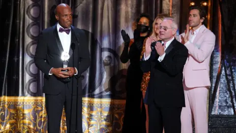 Getty Images Kenny Leon accepting the award for best revival of a play for A Soldier's Play