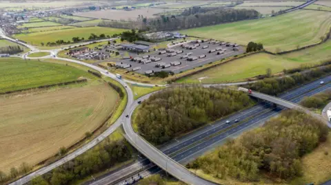 An artist's impression of the Barnetby Top lorry park with the junction of the A15 and M180 captured.