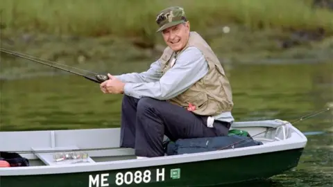 AFP George HW Bush enjoying some downtime on the Kennebunk River in 1990