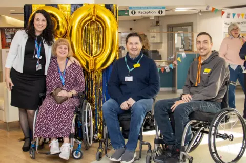 BUCKINGHAMSHIRE HEALTHCARE NHS TRUST Patients and staff celebrate the centre's 80th anniversary