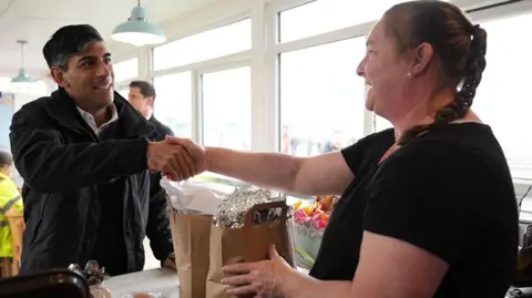 PA Media Rishi Sunak buys breakfast