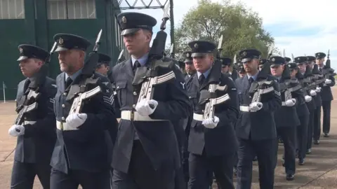 Personnel in uniform parading