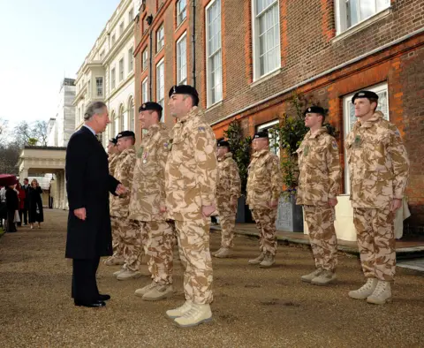 Getty Images Prince Charles presented Afghanistan Service Medals to soldiers in the garden of Clarence House, 2010