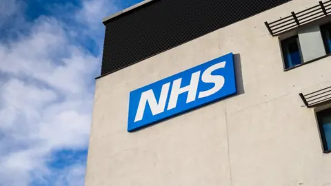 Getty Images View of the NHS (National Health Service) logo.