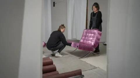BBC Madeleine Pledge, 25, and Eva Gold, 24, prepare an exhibition at SET