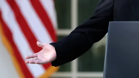 Getty Images Trump's hand as he speaks in Rose Garden