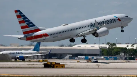 Getty Images An American Airlines plane leaves a runway