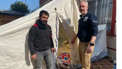 Foreign, Commonwealth and Development Office  Erlend Linklater (right) at one of the many temporary camps set up in Antakya