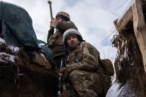 Getty Images Ukrainian soldiers in trenches near Luhansk