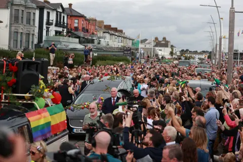 PA Media The funeral cortege of Sinéad O'Connor in Bray, Ireland, on 8 August 2023