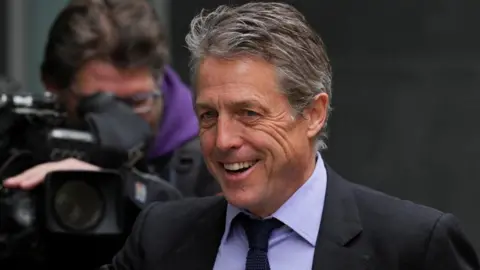 Reuters Hugh Grant arriving at court