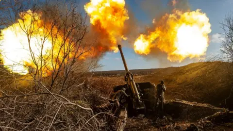 Reuters Ukrainian forces fire at Russian positions at the front line near Soledar, Donetsk region, Ukraine