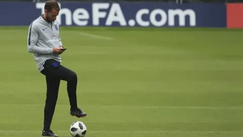 Getty Images Gareth Southgate on his phone