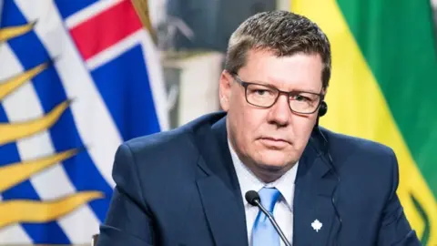 Getty Images Scott Moe looks on as prime ministers of the Canadian provinces gather during a meeting set-up by Canada prime minister Justin Trudeau in Montreal, on December 7, 2018