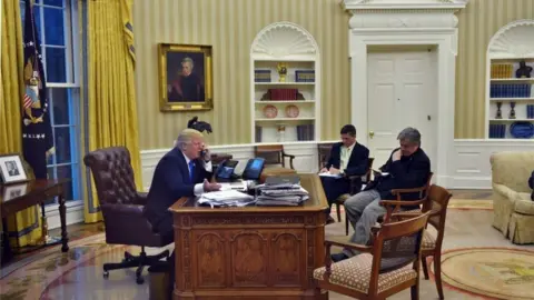 AFP US President Donald Trump on the phone to Australian PM Malcolm Turnbull (Jan 2017)