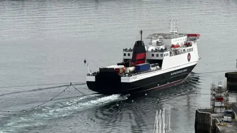 The Ben-my-Chree sailing our of Douglas Harbour. The vessel is white, black and red.