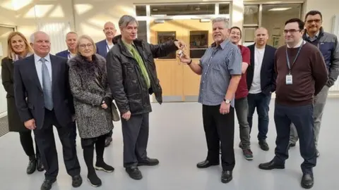 Basildon Council Leader of Basildon Council, Cllr Andrew Baggott (left) handing over the keys to the newly refurbished Laindon Community Centre to Chairman of the Committee, David Kerr.