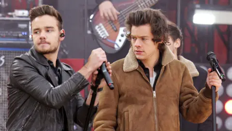 Liam Payne and Harry Styles of One Direction perform on 'Good Morning America' in Central Park in New York City in 2013