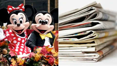 Getty Images Mickey and Minnie Mouse and some newspapers