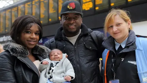 Network Rail Evelyn Brandao with baby Reign and partner Hervon Charles and Justyna Syla Station Shift Manager