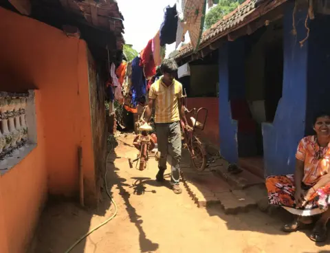 SuprIya Vohra A man walks down a street in Sonshi