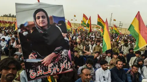 Getty Images Supporters of Balochistan National Party (BNP) carry posters of arrested Baloch activist Mahrang Baloch during a protest in Quetta on May 2, 2025.