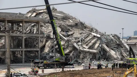 Getty Images State Audit Office skyscraper reduced to rubble.