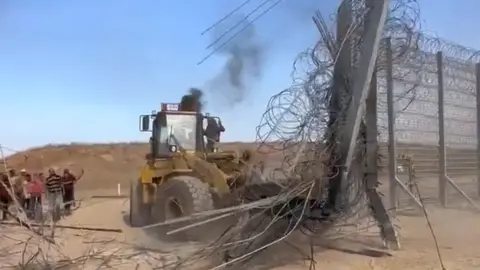 Social media Bulldozer destroys section of Gaza barrier