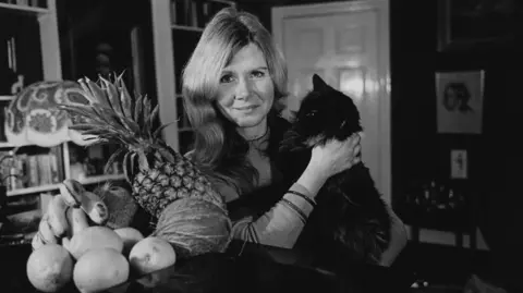 Getty Images Jilly Cooper photographed holding her cat in 1975