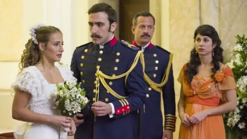 Courtesy Rede Globo Otávio. played by Pedro Henrique Muller, looks at Lídia Benedito, played by Bruna Griphão