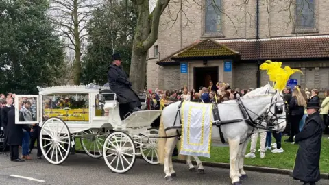 BBC The scene of Leah Smith's funeral outside the church