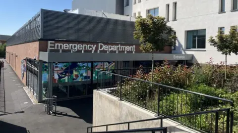 Worcestershire Royal Hospital's new emergency department, with sign above the door 