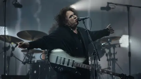 PA Media Robert Smith of The Cure