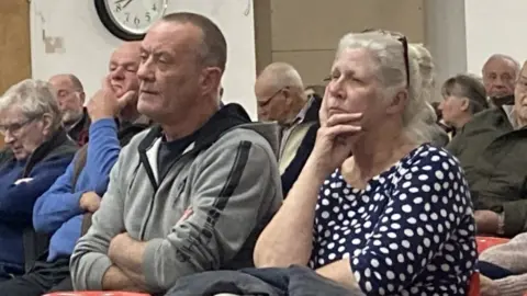 Sharon Edwards/BBC Residents at a public meeting to discuss flood response
