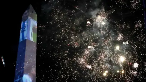  RAUL MARTINEZ/EPA-EFE Argentina supporters celebrate after winning the FIFA World Cup Qatar 2022 at the Obelisco in Buenos Aires, Argentina, 18 December 2022.