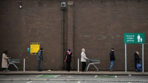 Getty Images Supermarket queue in Glasgow