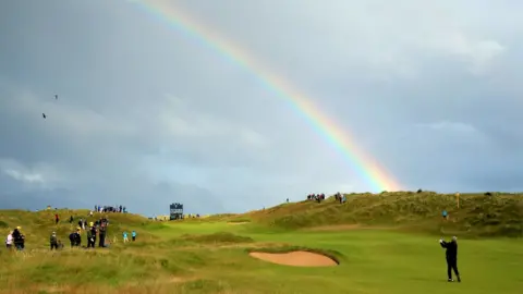 ALLSPORT/Getty Images Darren Clarke in action at the seventh hole in the opening round
