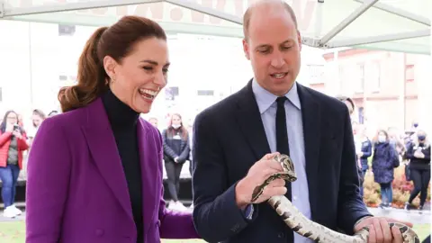 PA Media Prince William and Catherine meet a snake during visit to derry
