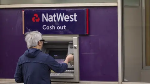 Customer using NatWest ATM