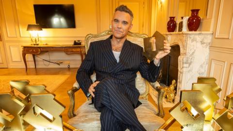 Robbie Williams Outshines The Beatles with Historic Chart Record