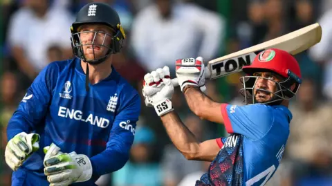 Ikram Alikhil (right) bats for Afghanistan while England captain Jos Buttler (left) keeps wicket