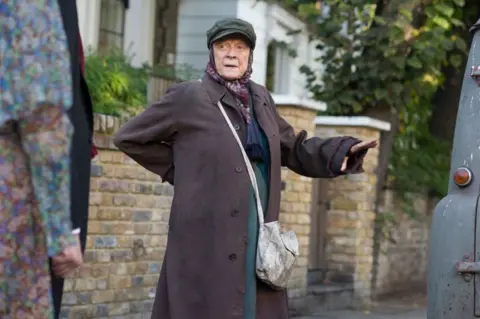 Getty Images Dame Maggie Smith in a scene from Alan Bennett's "The Lady In The Van" directed by Nicholas Hytner in 2014 in London, UK