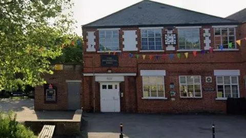 Google Street view of the outside of a building, which has a Natwest ATM, in St John's Street, in Wirksworth near Matlock in Derbyshire.
