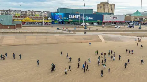 Sea Life Blackpool volunteers on the beach