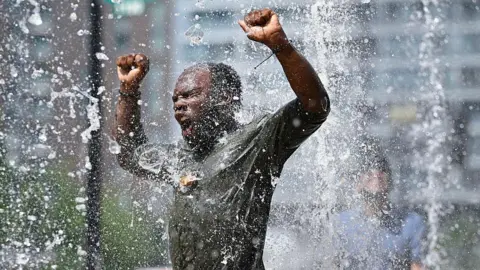 A man seen enjoying a blast of water