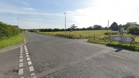 A google street view screenshot of the junction between Peter Lane and Dalston Road.