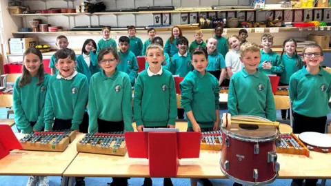School children and musical instruments.