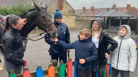 BBC Children meet horse Frodon at Wincanton primary school