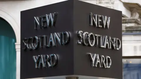 Reuters New Scotland Yard sign